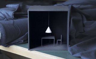The cone shaped lamp is covered in a cotton normally reserved for men's shirting.
