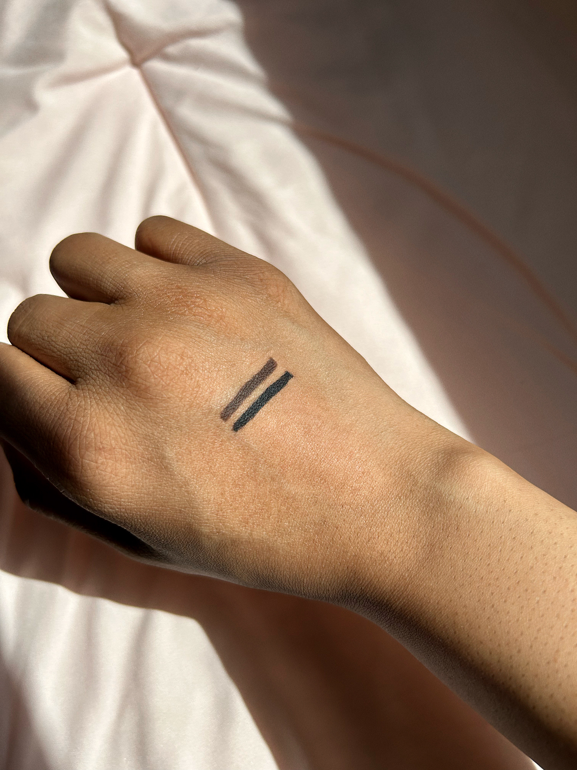 Maybelline TattooStudio Gel Pencil Eyeliner swatches on back of hand