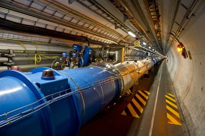 The LHC tunnel where particles accelerate.