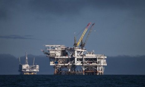 Oil rigs off the coast of Long Beach, Calif.: The Obama administration has approved more than 400 drilling permits since the BP oil spill nearly two years ago.