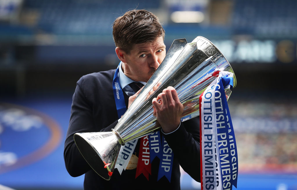 GLASGOW, SCOTLAND - MAY 15: Rangers Manager Steven Gerrard is seen kissing the trophy during the Scottish Premiership match between Rangers and Aberdeen on May 15, 2021 in Glasgow, Scotland. Sporting stadiums around the UK remain under strict restrictions due to the Coronavirus Pandemic as Government social distancing laws prohibit fans inside venues resulting in games being played behind closed doors. (Photo by Ian MacNicol/Getty Images)