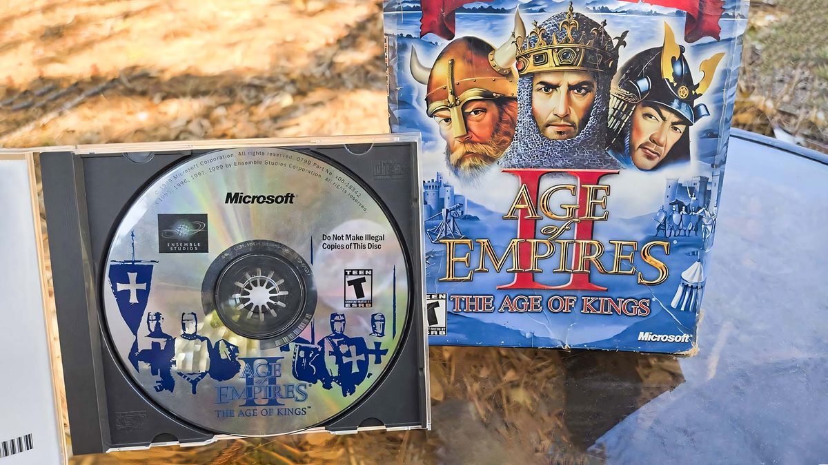 Age of Empires II: Age of Kings original 90s disk in front of the original Game of the Year game box. 