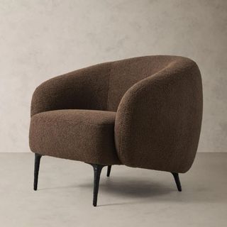 A brown boucle armchair from Banana Republic