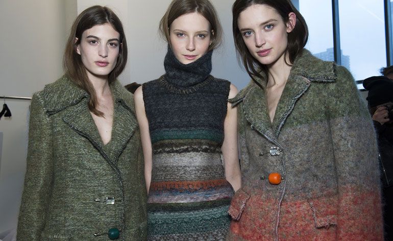 3 female models in winter knitwear &amp; large coats