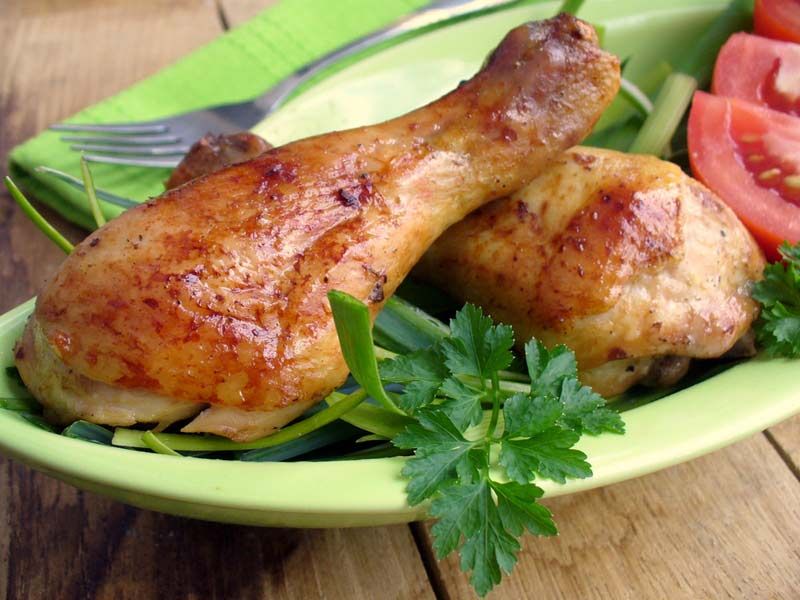 chicken drumsticks on a plate.