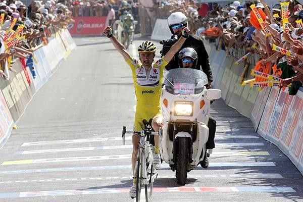 Piepoli takes victory with just visible in the background.