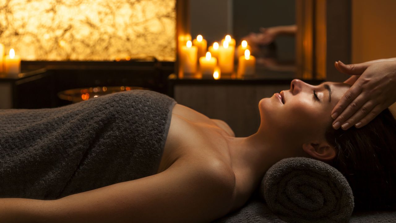 A woman in one of the best spas in the UK, getting a head massage