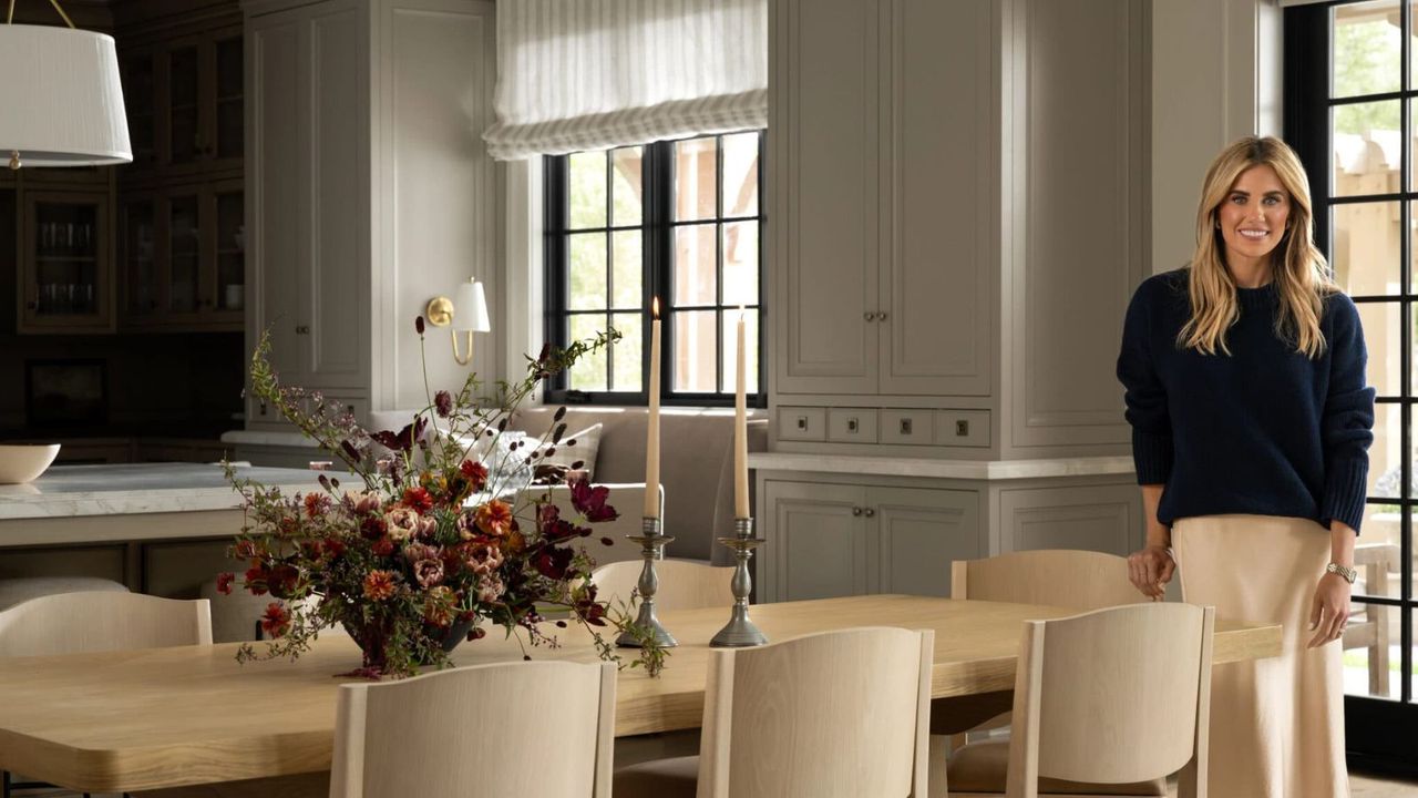 modern neutral kitchen with large wooden dining table and Shea McGee