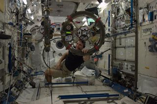 Mike Hopkins with SPHERES Mini Satellites on ISS