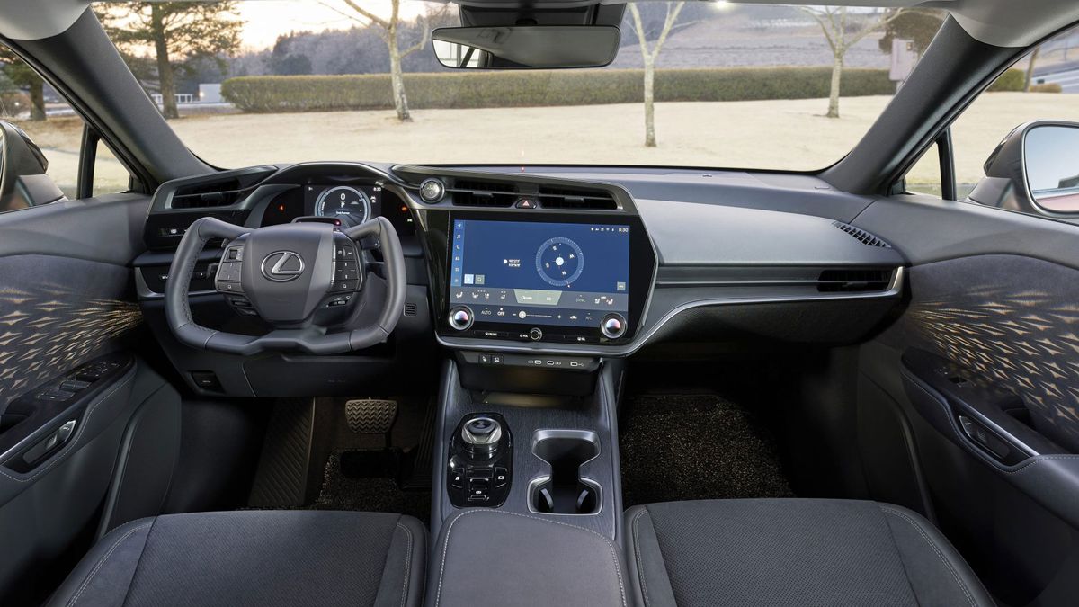 Full width view of the dash inside the Close-up of yoke steering wheel in the Lexus RZ 450e