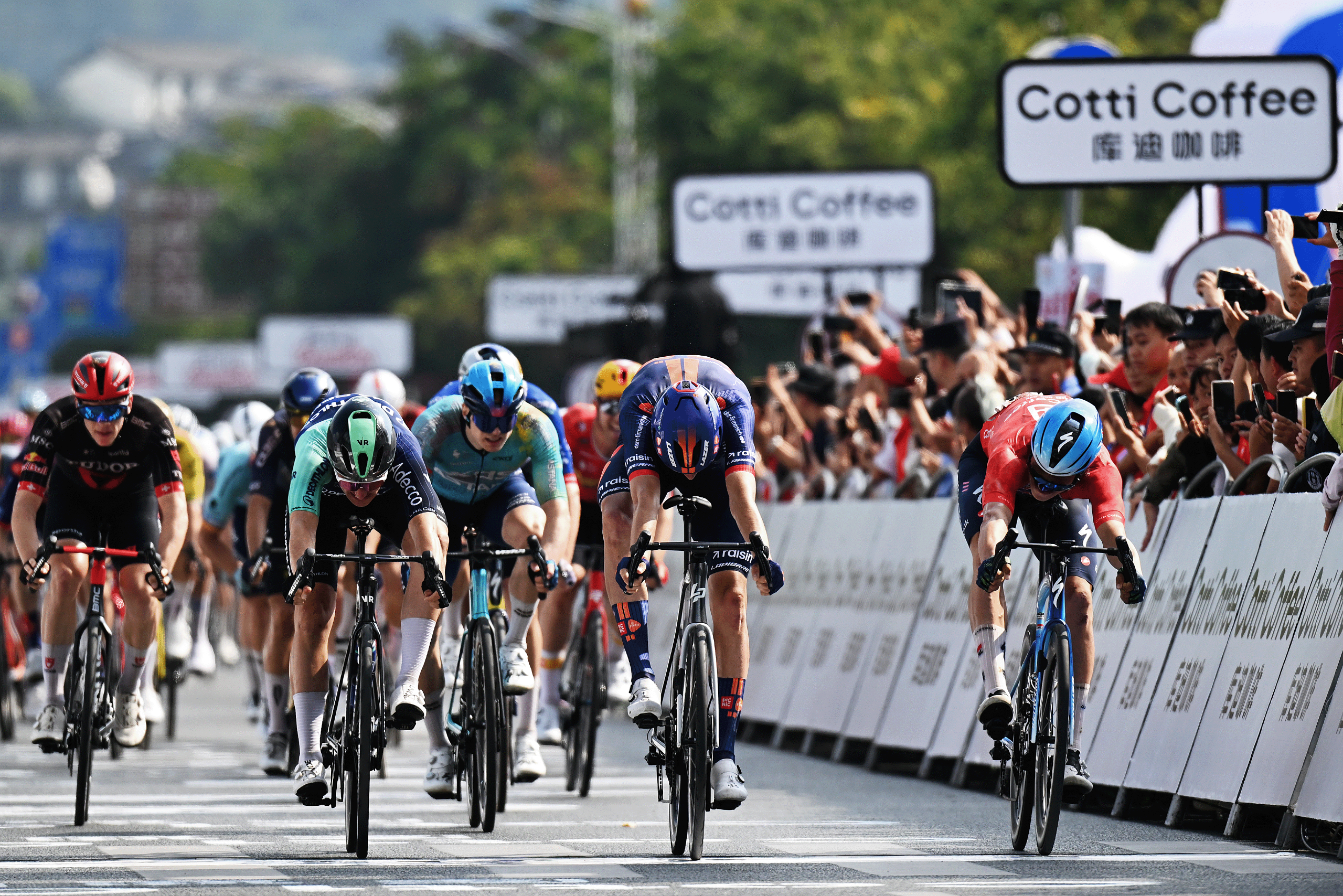 Stage winner, Frits Biesterbos of Netherlands and Team Picnic PostNL (C) sprints at finish line to win ahead of Olav Kooij of Netherlands and Decathlon CMA CGM (L) Team and Paul Magnier of France and Team Soudal Quick-Step - Red Leader Jersey (R) during the 7th Tour of Guangxi 2026, Stage 2 a 179.5km stage from Chongzuo to Jingxi 797m / #UCIWT / on October 14, 2026 in Jingxi, China. (Photo by Dario Belingheri/Getty Images)