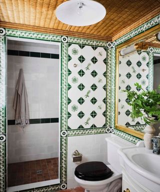 Vintage bathroom with green tiles and rattan ceiling