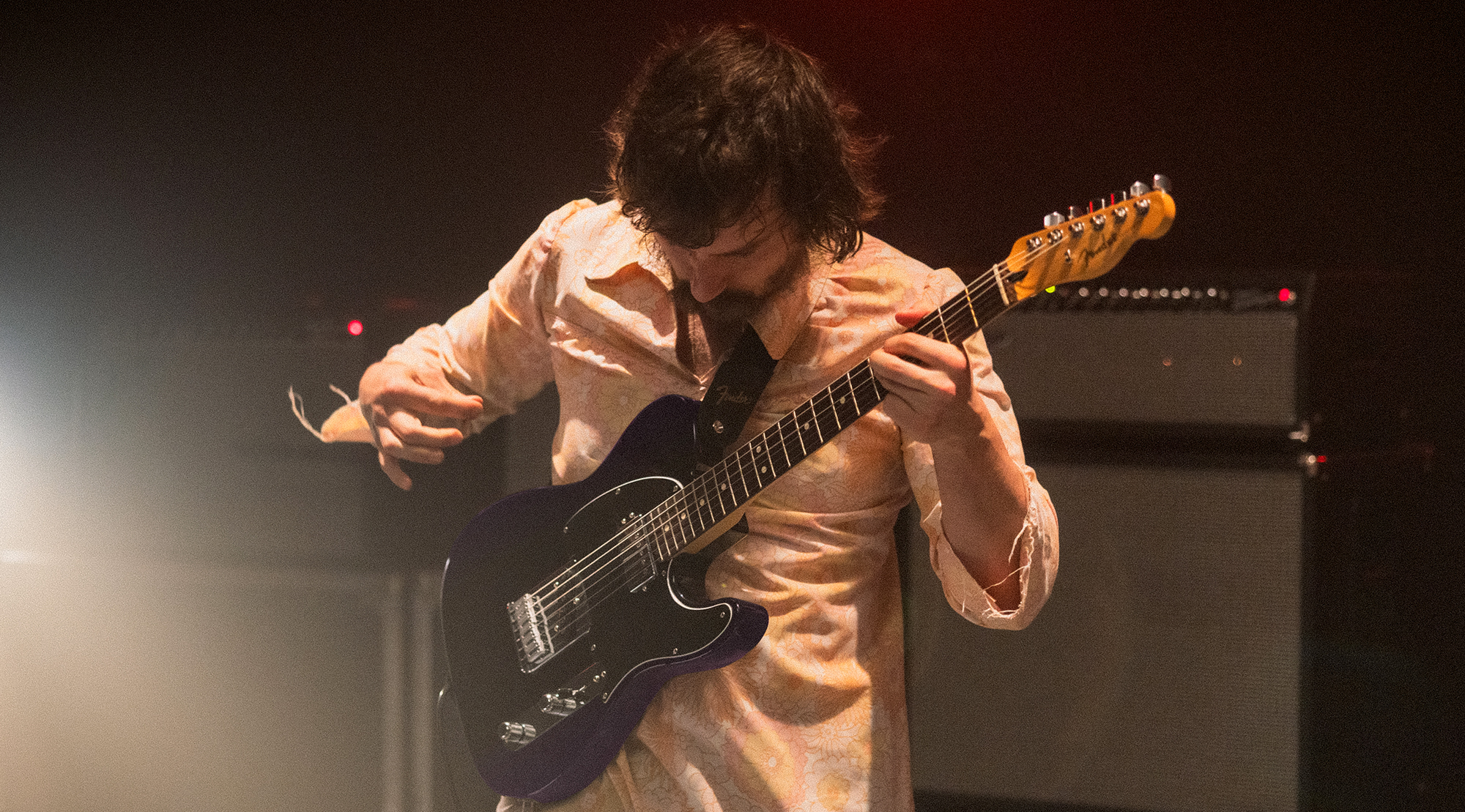 A photo of Mark Bowen, guitarist with the band Idles, playing a Fender Player II Modified Telecaster