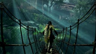 Unknown 9 Awakening review; a woman walks across a rope bridge in a jungle