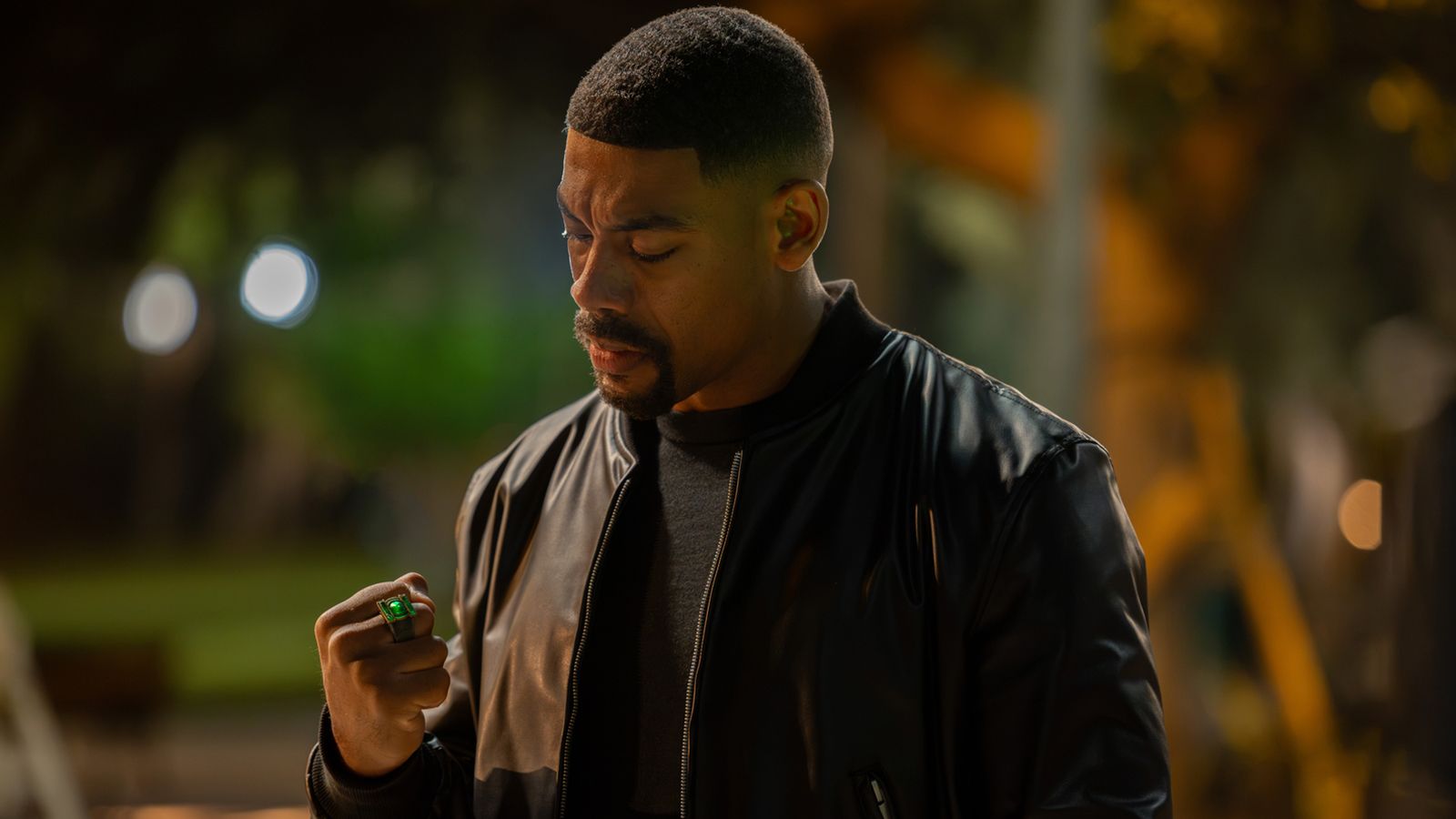 John Stewart looking at Hal Jordan's Green Lantern ring in Lanterns episode 8