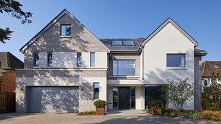 modern home with white render and grey stone