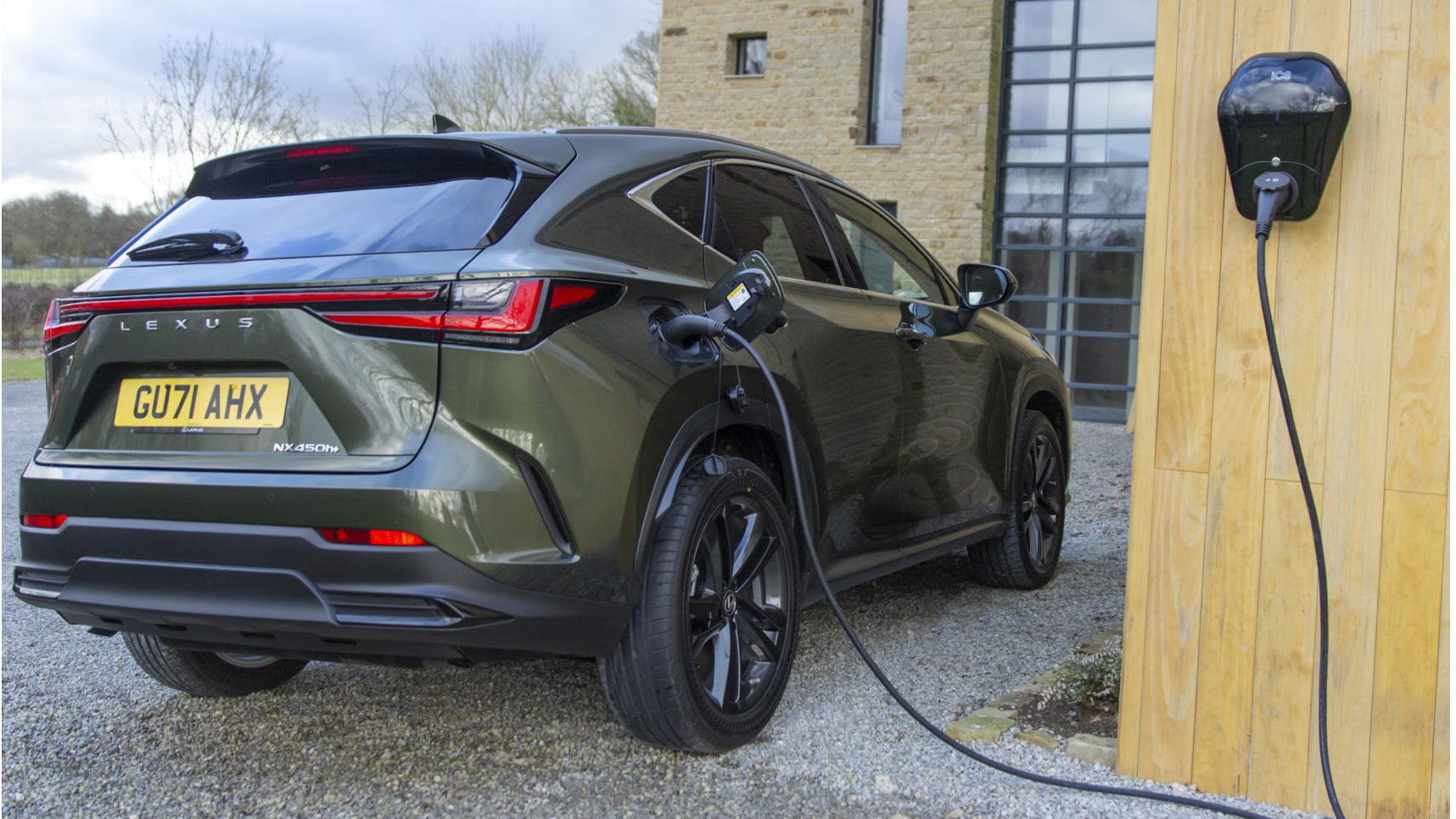 lexus nx 450h+ hybrid plugged into wallbox charger