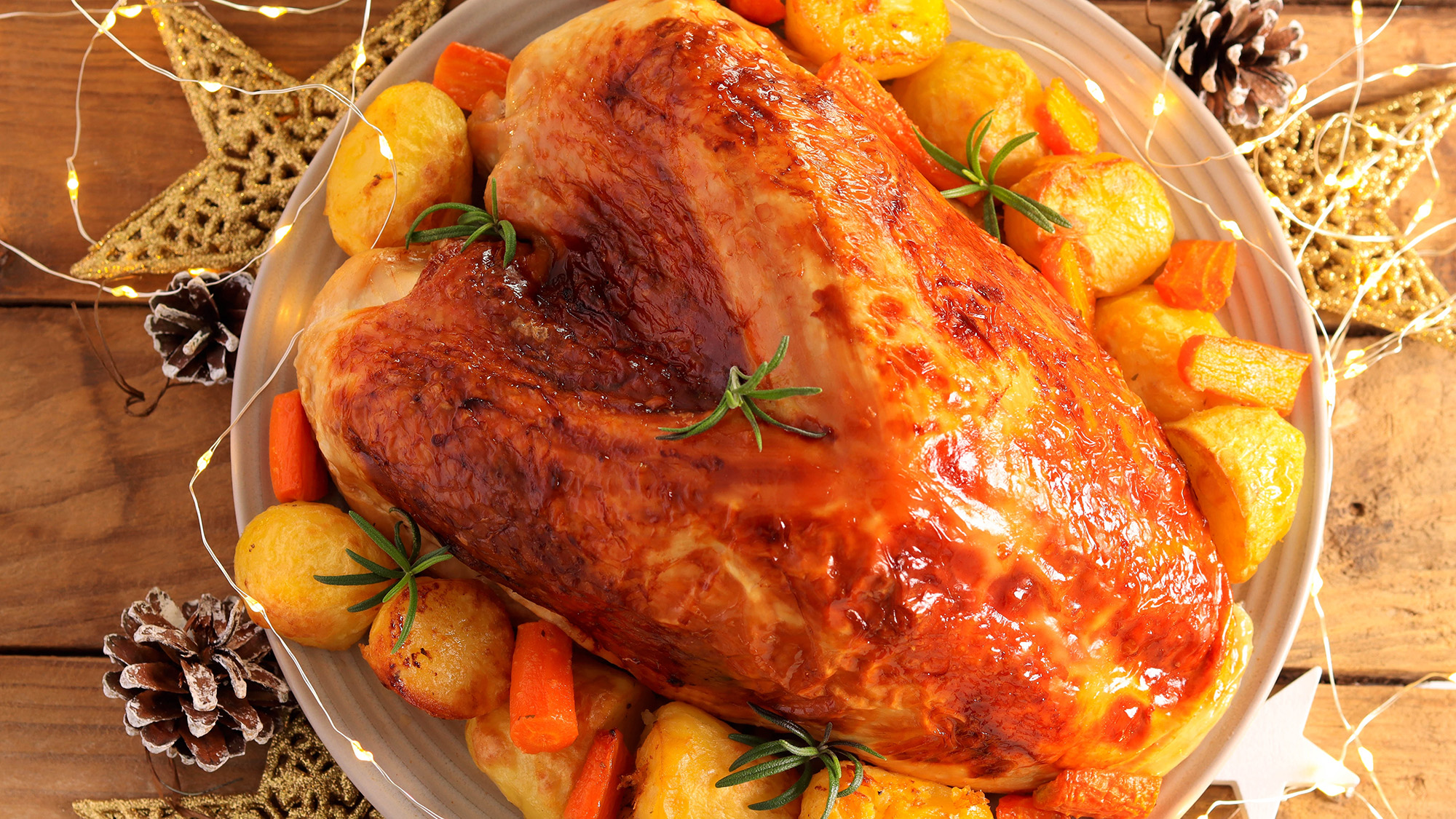 Luxury turkey crown, festive roast breast of turkey with potatoes and carrot