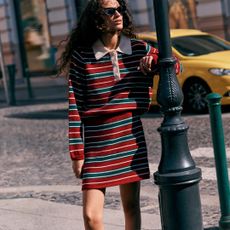 Woman in red and green striped set from NEXT