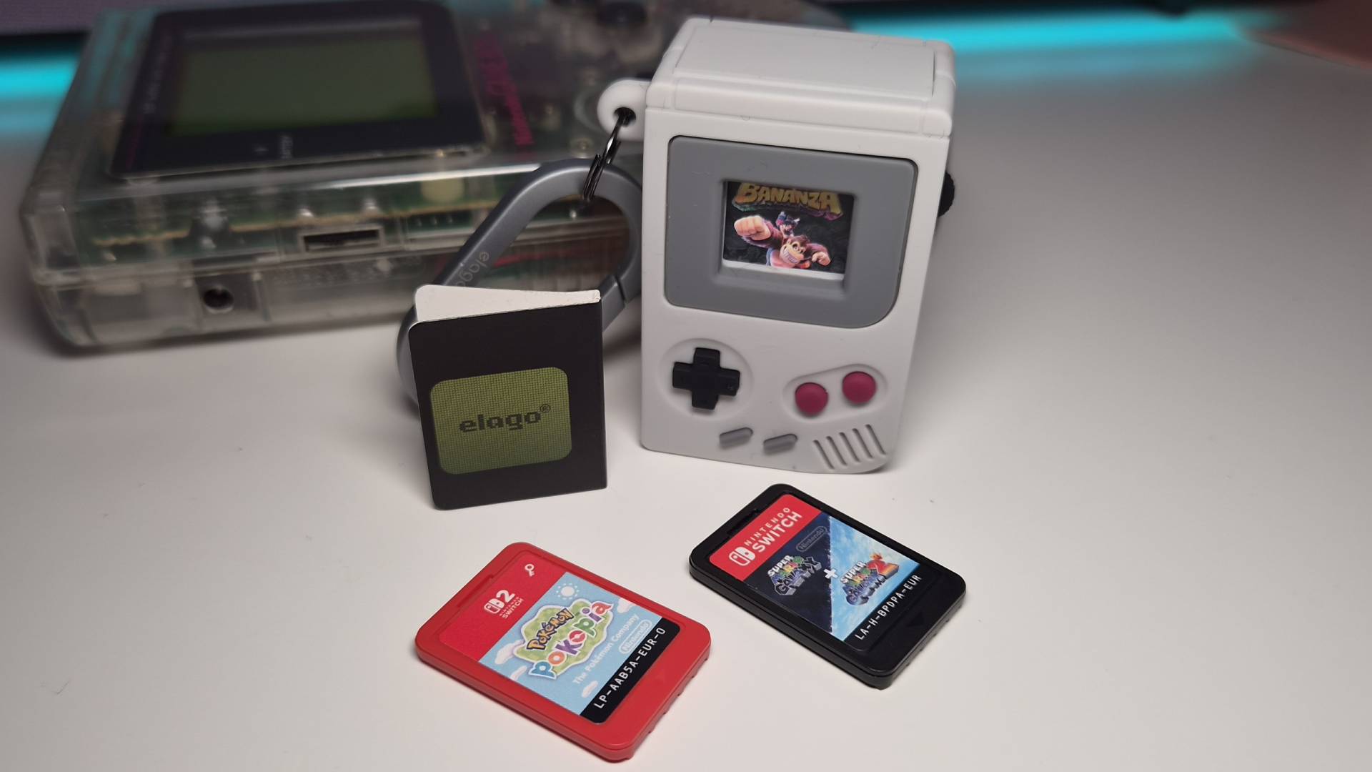 Photo of Switch games next to the elago Switch Game Case.