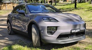 The Porsche Macan electric car parked on grass