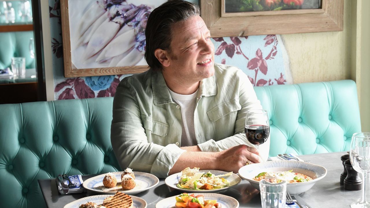 Jamie Oliver poses for a photo before a brunch at Jamie's Italian onboard Royal Caribbean's Ovation of the Seas in 2023