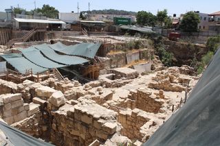 The Givati Parking Lot is the site of an immense excavation that has resulted in finds from the Middle Age to ancient times. Dating to the third to fourth centuries A.D., the Roman mansion, where the curse tablet was excavated, was only one of them. This image shows excavations at the various ruins found in the parking lot.
