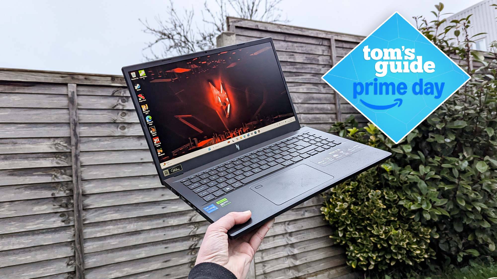 Acer Nitro V 15 in hand with Tom's Guide Prime Day badge