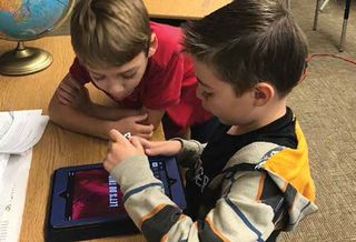 Third-grade students at Biltmore Preparatory Academy in the Creighton Elementary SD collaborate on a project.