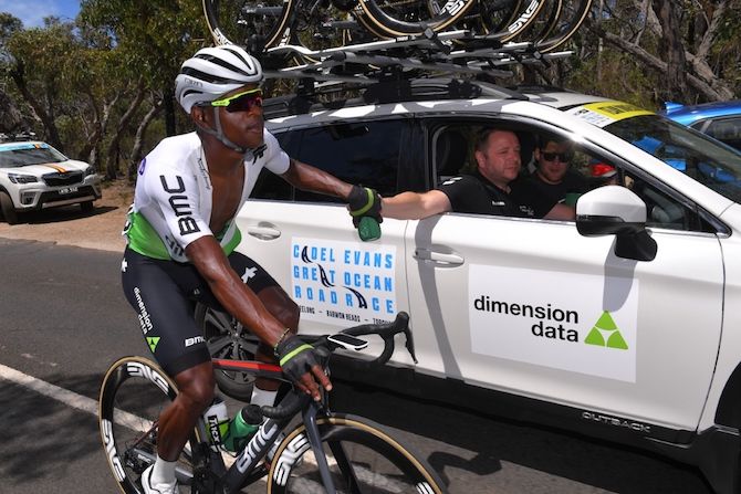 Dimension Data's Nic Dlamini takes a drink from his team car, and later went on the attack on the finishing circuits