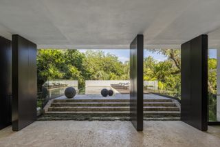 View to poolside terrace through vertical metal fins