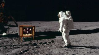 Buzz Aldrin watching a TV on the moon which is showing Queen's Bohemian Rhapsody