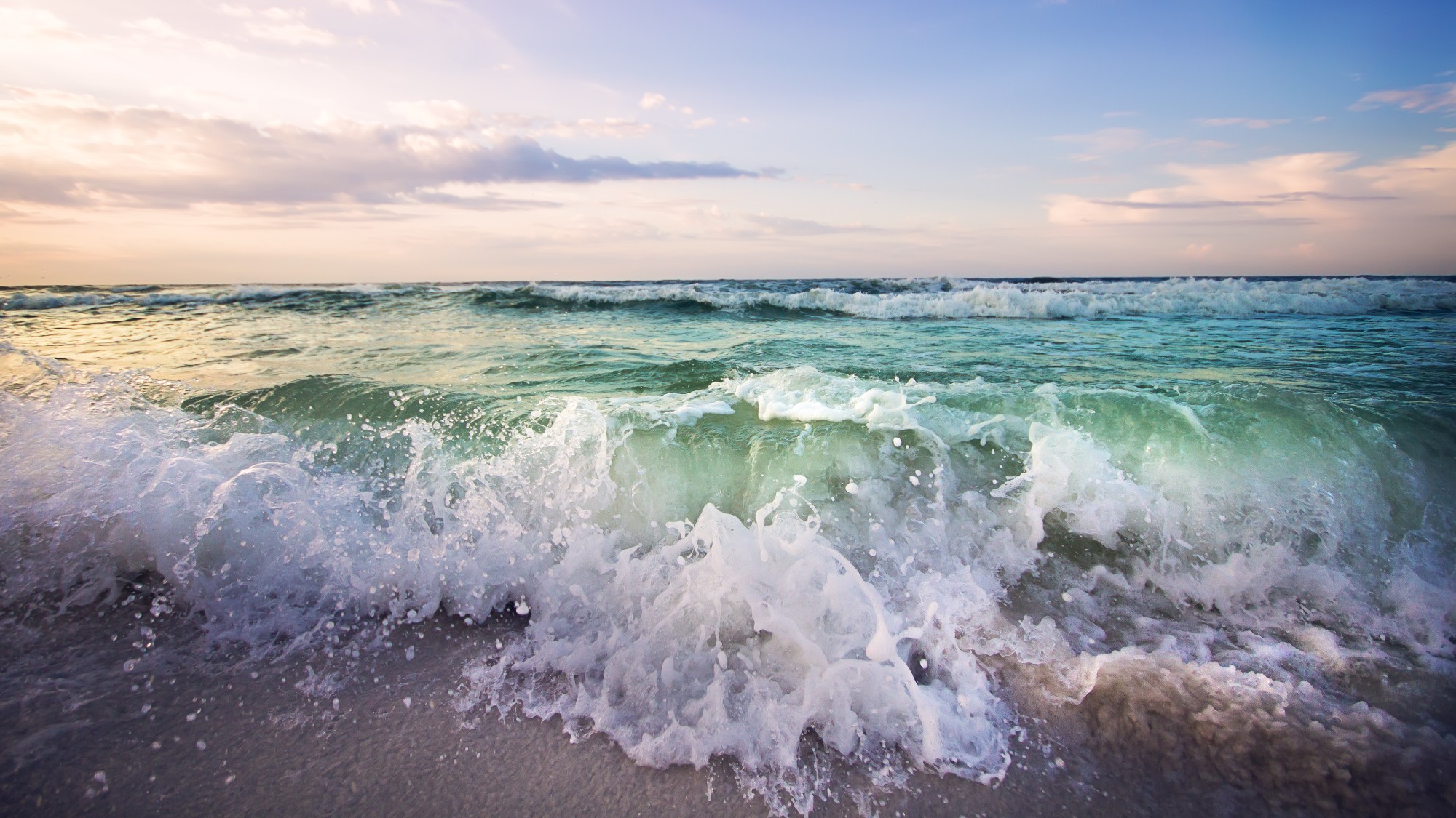 Surf crashes on a Gulf Coast shoreline