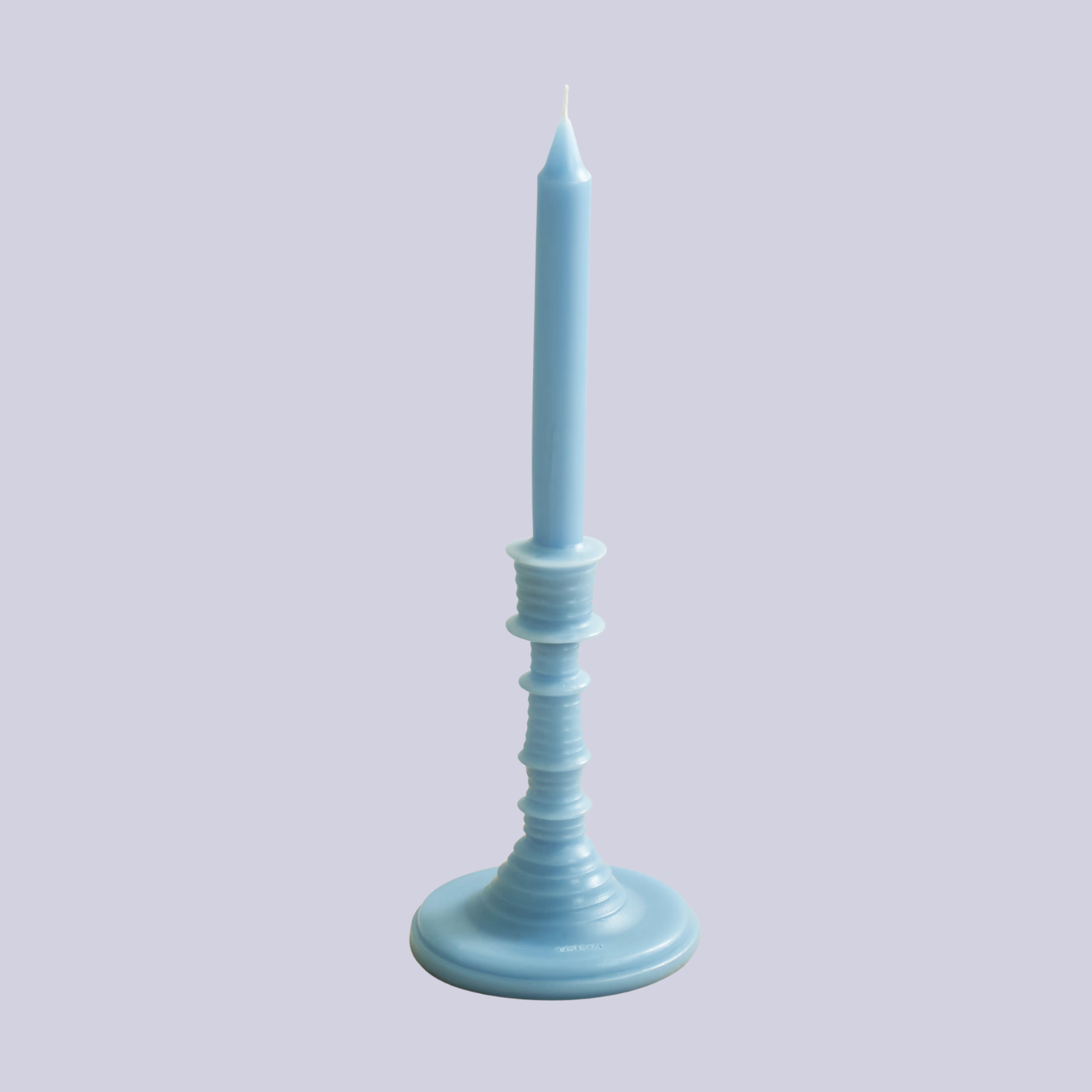 A light blue tapered candle