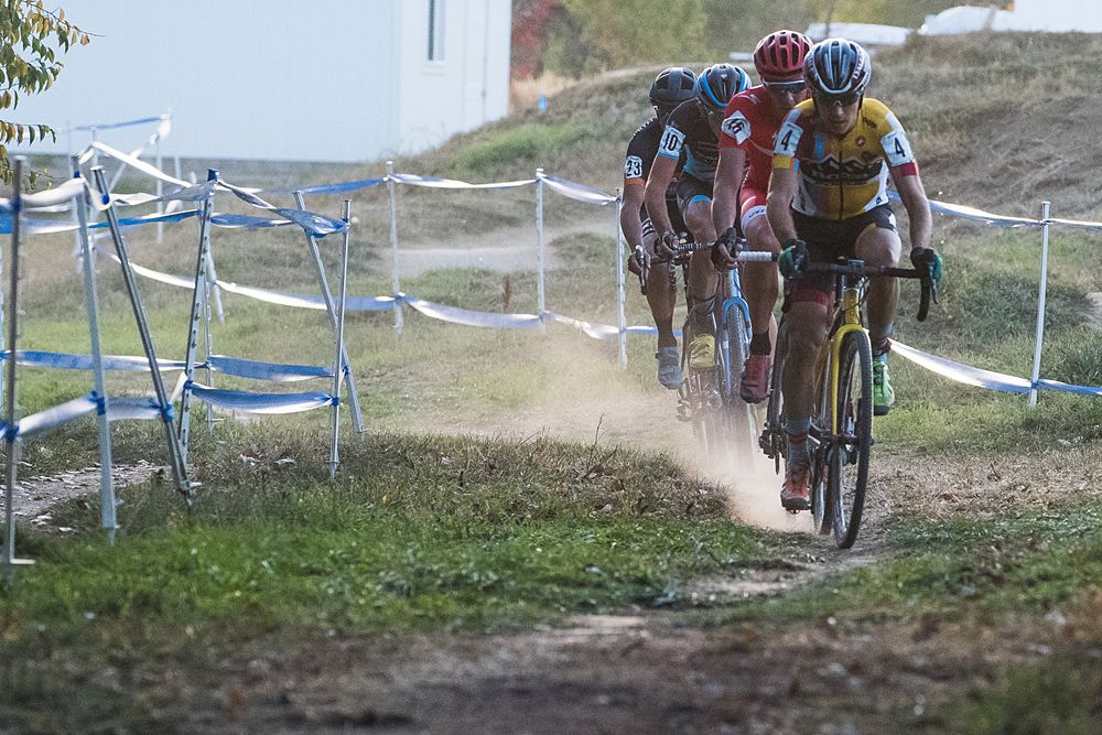 Allen Krughoff (Noosa) leads the group of riders with 2 laps to go.