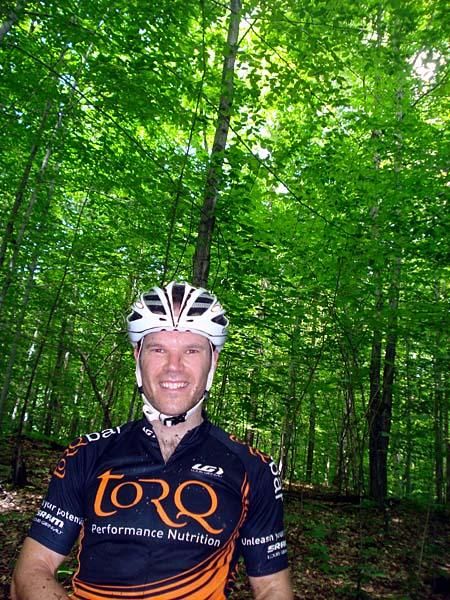 Tim out training with me on the Bromont Course, showcasing the stunning forest canopy.