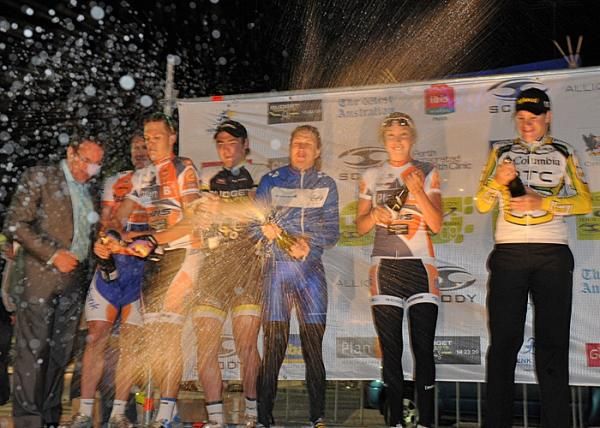 The men's and women's podium finishers kick off celebrations with some champagne.