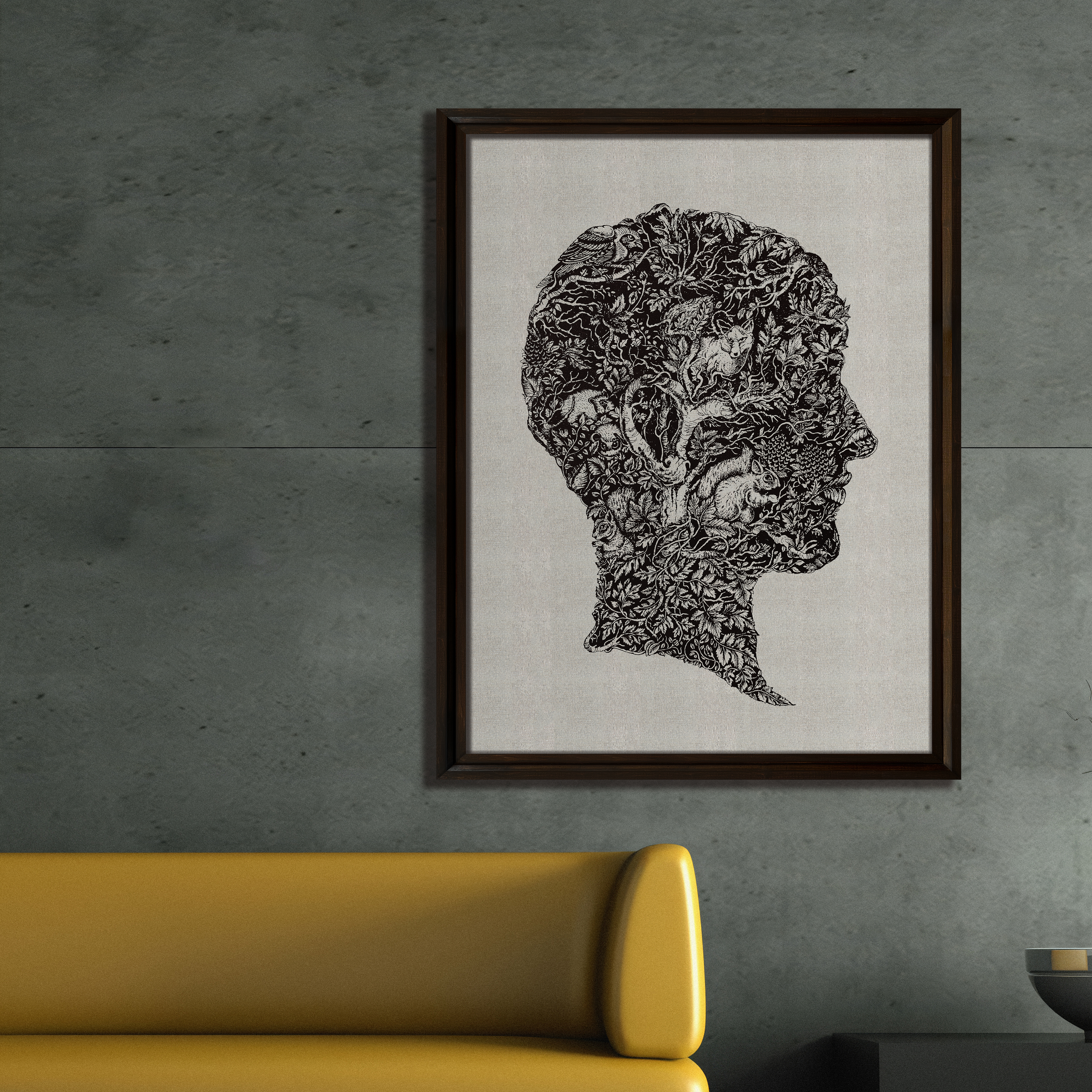 hand embroidered artwork hung on concrete wall