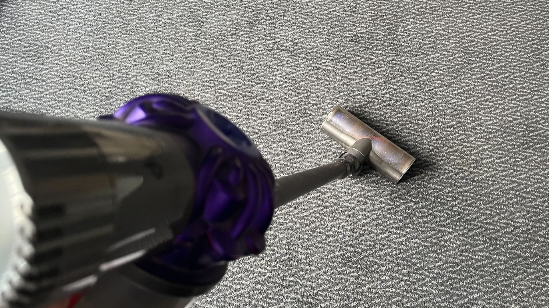 picture of me vacuuming the carpet with a dyson vacuum
