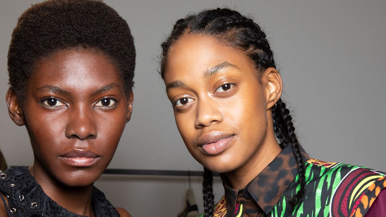 two models looking directly at the camera - Eyebrow threading - getty 1276958072