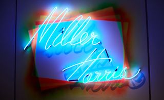Neon sign saying Miller Harris in blue