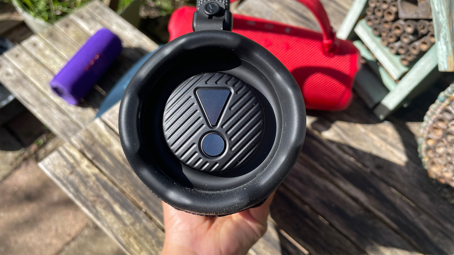 The end of a black JBL Charge 6 wireless speaker.