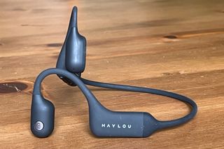 Haylou PurFree wireless bone conducting headphones on a wooden table