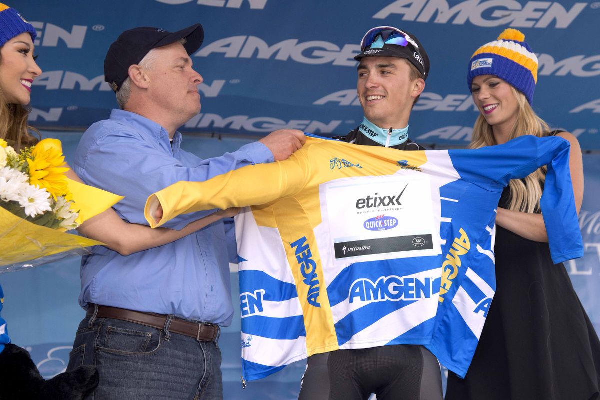 Julian Alaphilippe (Etixx-Quickstep) pulls on the leader's jersey