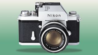 Silver Nikon F Photomic Tn on a green to cream gradient