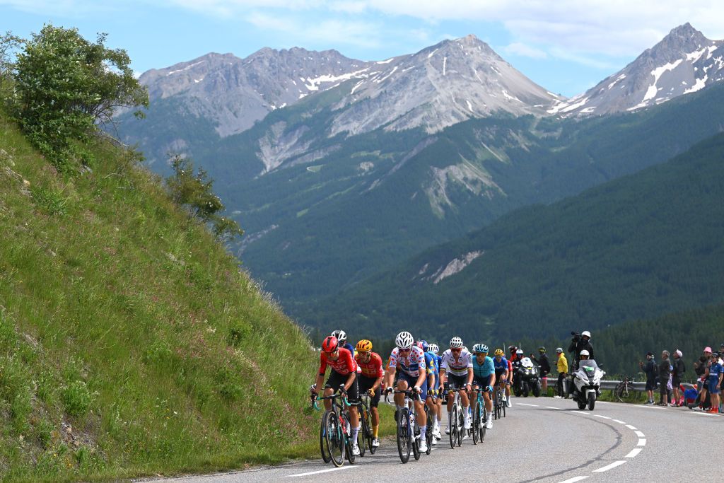 VALLOIRE FRANCE JULY 02 LR Cristian Rodriguez Martin of Spain and Team Arkea BB Hotels Tobias Halland Johannessen of Norway and Team UnoX Mobility and Valentin Madouas of France and Team Groupama FDJ Polka Dot Mountain Jersey lead the peloton during the 111th Tour de France 2024 Stage 4 a 1394km stage from Pinerolo to Valloire UCIWT on July 02 2024 in Valloire France Photo by Dario BelingheriGetty Images