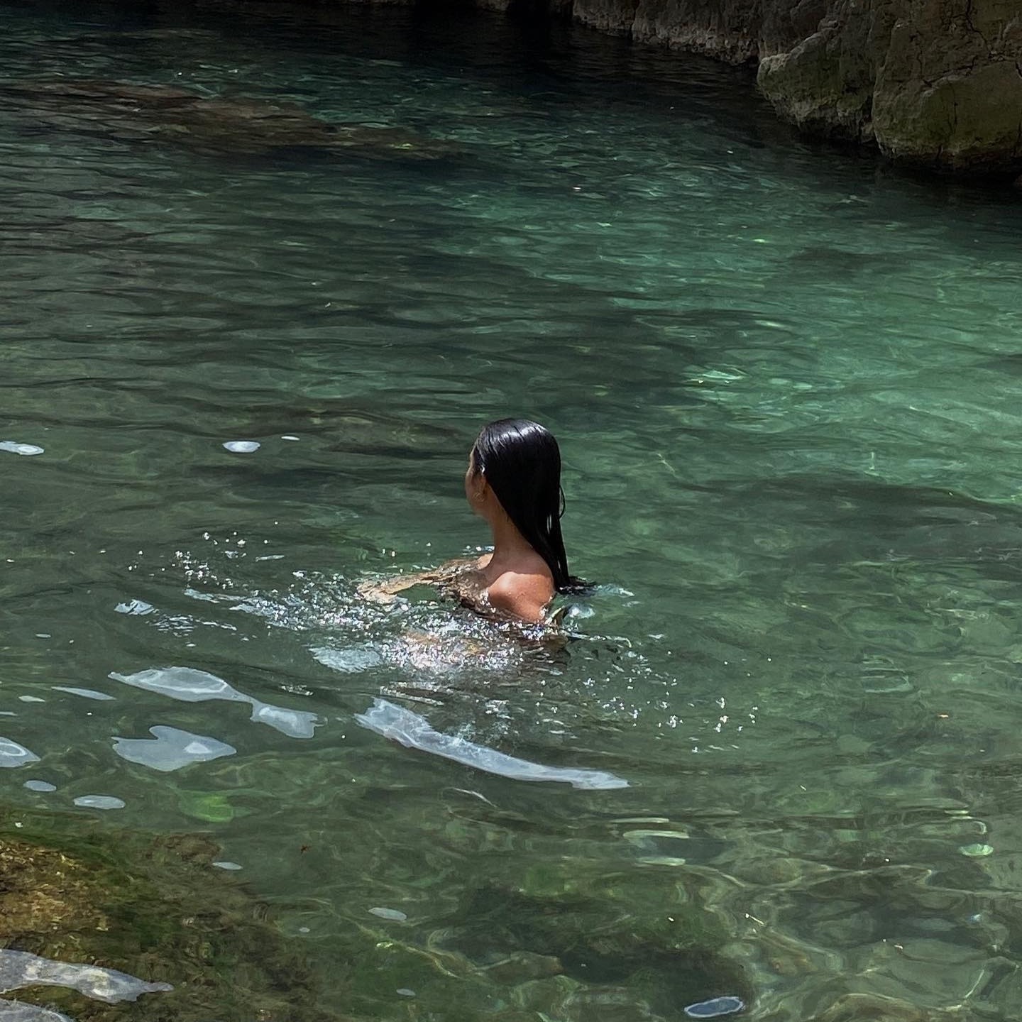 Woman swimming in water