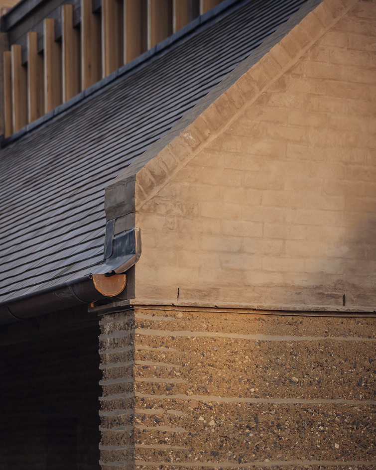 view of Rammed Earth House by Tuckey Design Studio with tactile walls and earth tones
