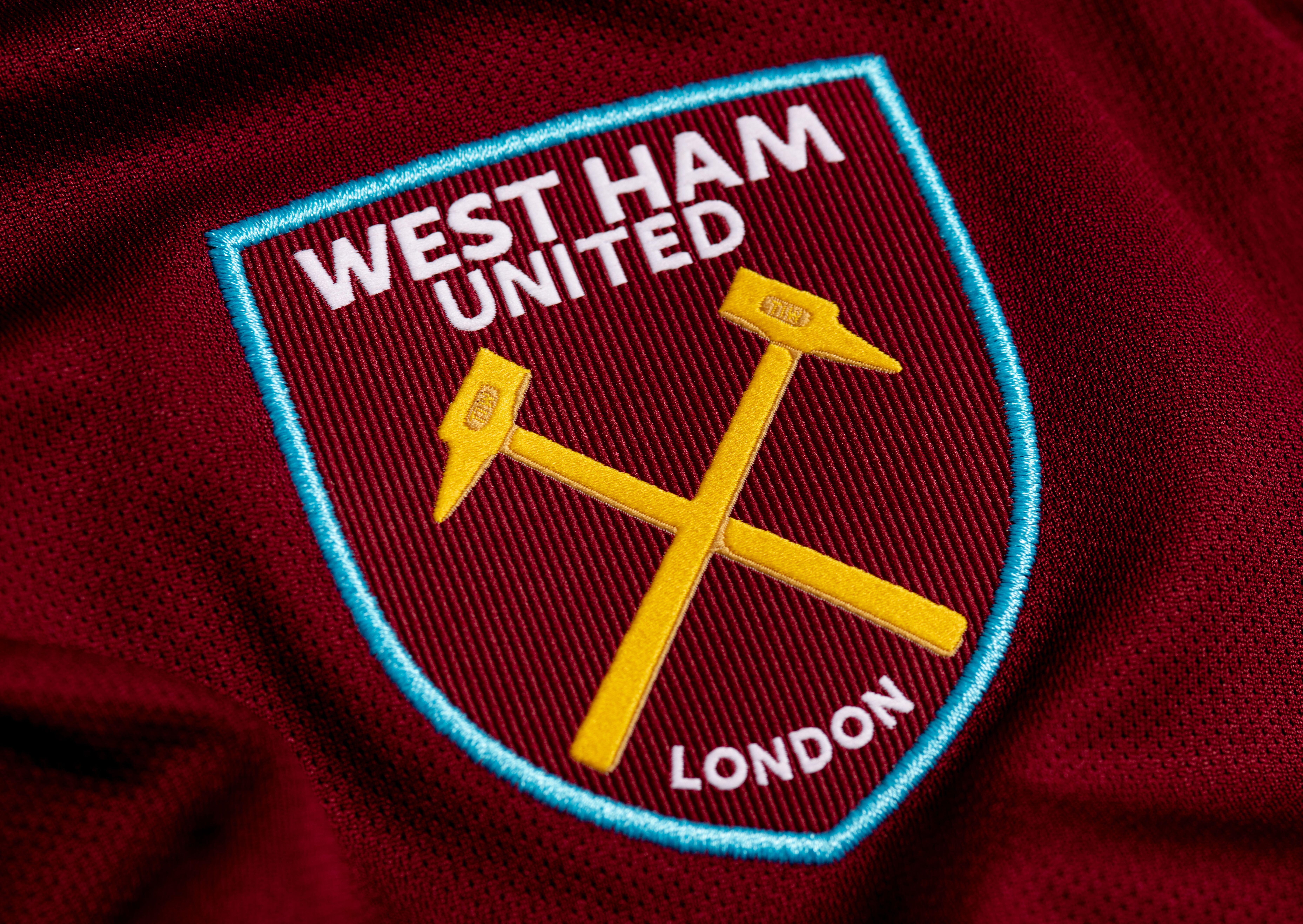 The West Ham United badge on a claret shirt