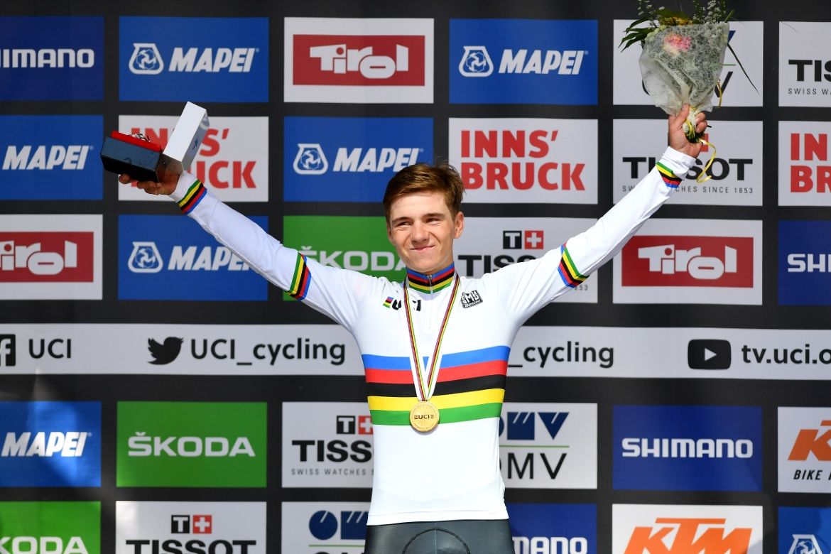 Remco Evenepoel celebrates on the podium